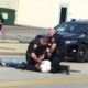 Police are seen violently arresting Richard Hubbard III while his companion looks on and records with a cellphone. (Leshaunda Malone via Facebook)